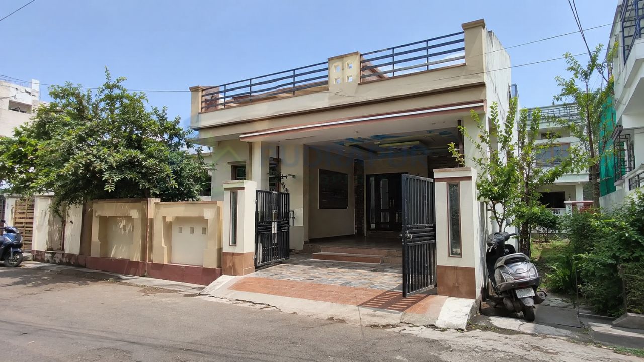 Modern independent house in Rudrapur, Uttarakhand, featuring a private entrance, covered parking, and spacious residential design in a peaceful neighborhood.