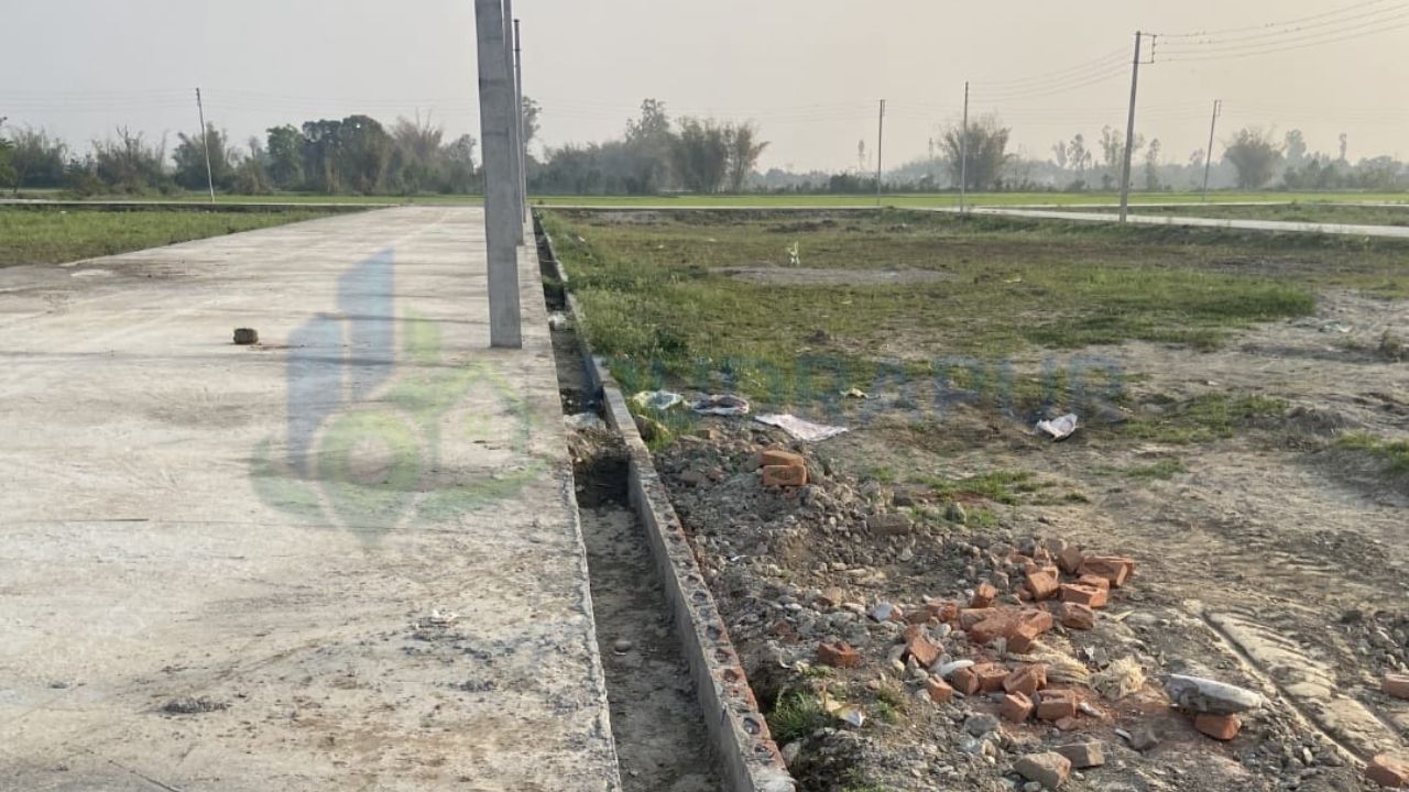 Affordable residential plots on Dineshpur Road Rudrapur with concrete roads, electricity infrastructure and green surroundings